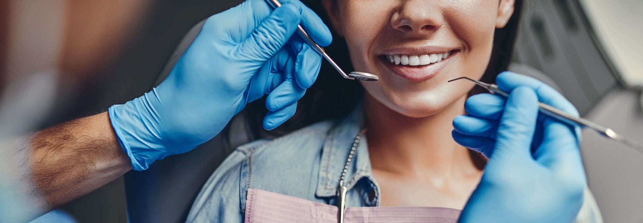 patient having teeth checked by dentist