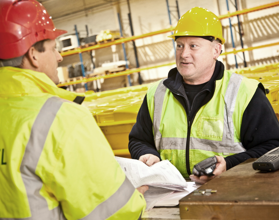 Stericycle workers discussing procedures