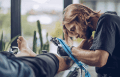 tattoo artist working