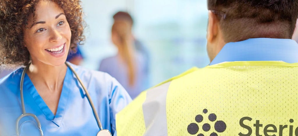 healthcare nurse talking to stericycle staff member