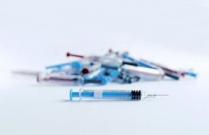 Drug therapy and everyday injections, pile of syringes
